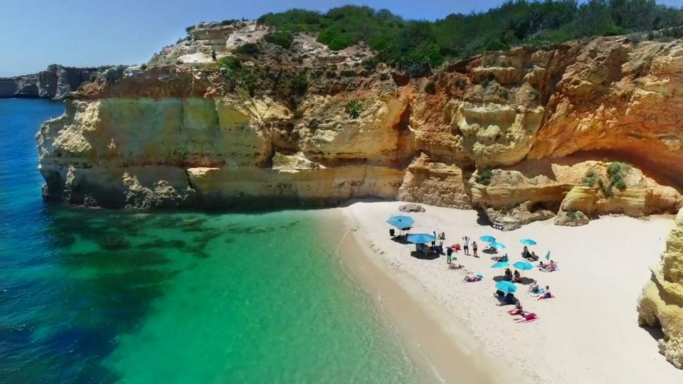 Albufeira: Catamaran Cruise With BBQ & Open Bar on the Beach - Exploring the Caves