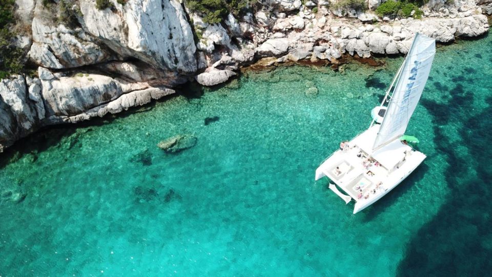 Alghero: Full Day on a Catamaran in Porto Conte Natural Park - Key Points