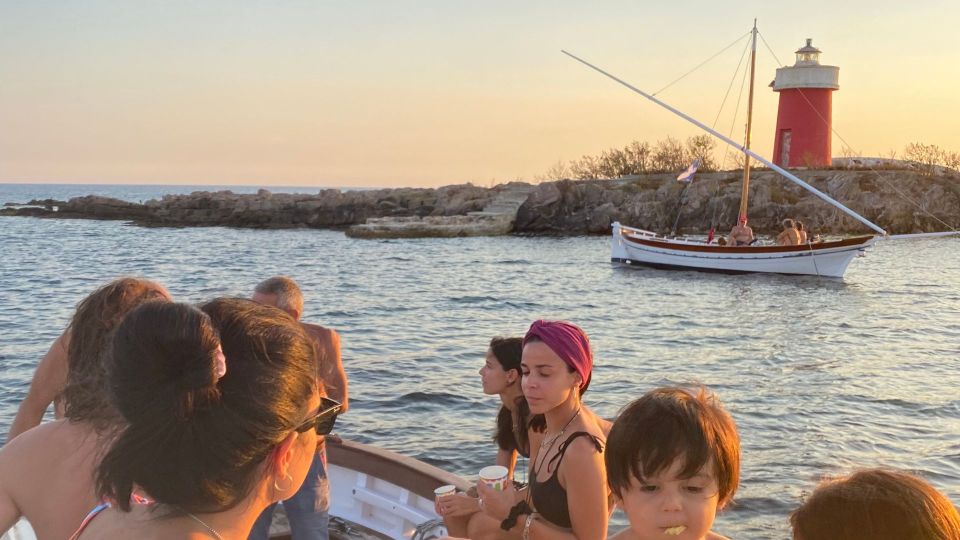 Alghero: Vintage Boat Sailing Class Excursion at Sunset - Meeting Point Location