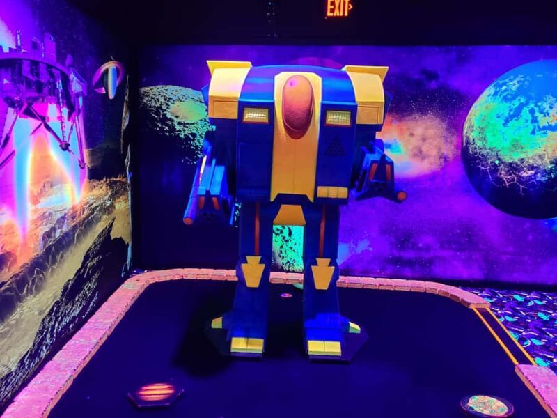 American Dream: Blacklight Mini Golf Entry Ticket - The Sum Up