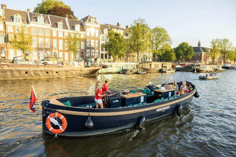 Amsterdam: Guided Open Boat Canal Cruise Including Drink - An In-Depth Look at the Experience