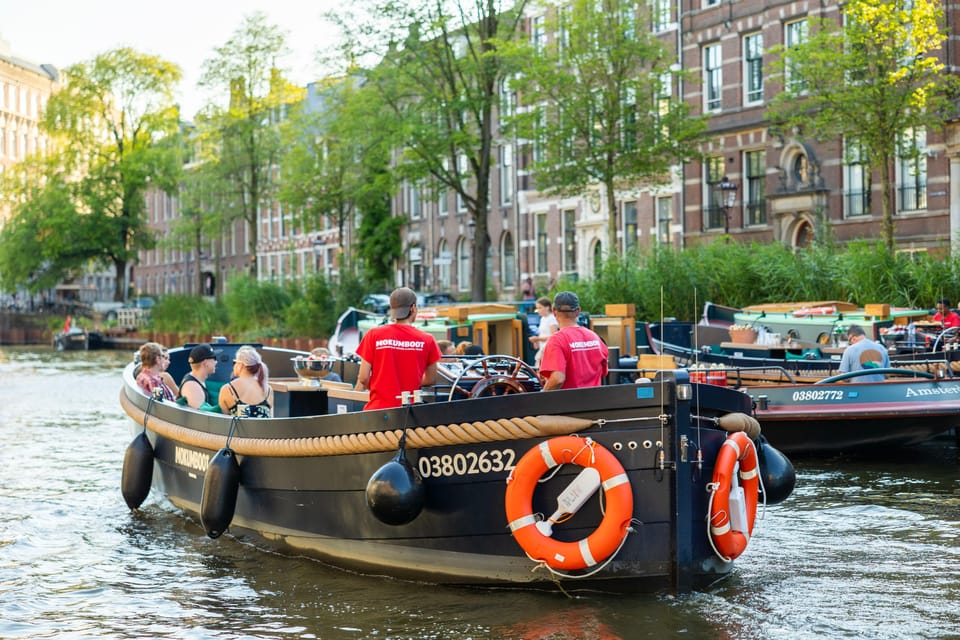 Amsterdam: Guided Open Boat Canal Cruise Including Drink - What Travelers Are Saying
