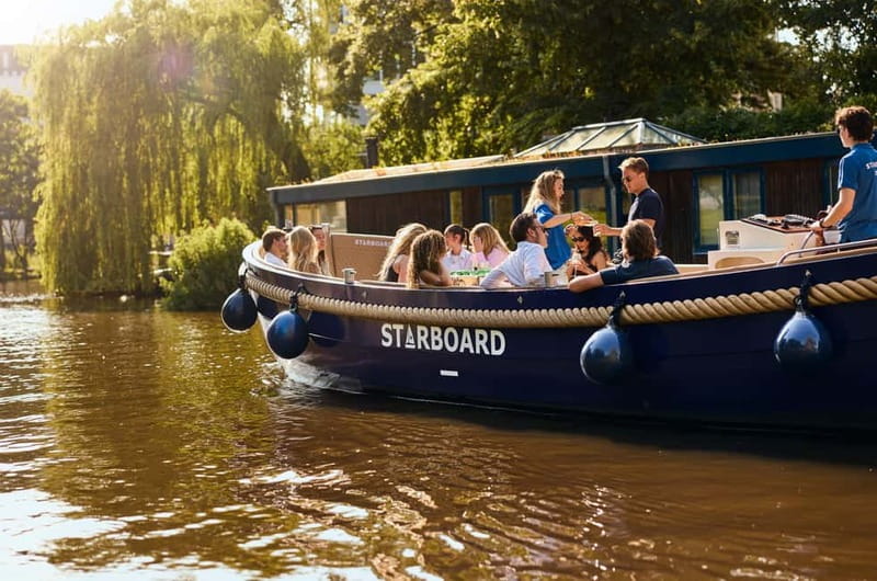 Amsterdam: Spanish Guided Open Boat Cruise with Bar Onboard - Key Points