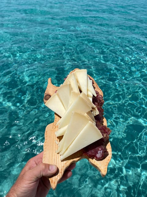 aperitifs at sunset on the Stintino catamaran burianaCharter - Itinerary Breakdown: Stops and Highlights