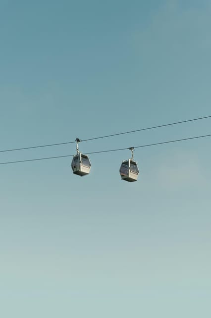 Barcelona by Air and Sea: Montjuic, Cable Car, Beach and Catamaran. - Beachside Exploration and Catamaran Cruise