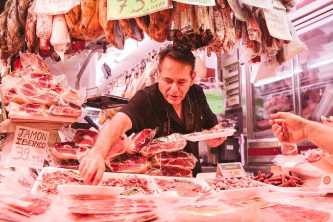 Barcelona: Hidden Markets, Tapas & Paella Food Tour - Enjoying a Seafood Paella Feast