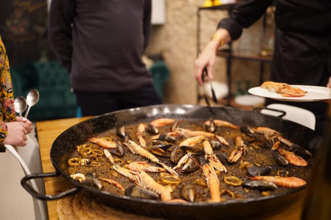 Barcelona: Seafood Paella Cooking Class & Boqueria Market - Enjoying the Full Meal and Beverages