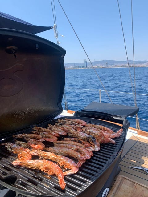 Barcelona: Sunset & Midday Sailing Experience - Onboard Amenities and Activities