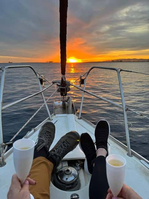 Barcelona: Sunset Sailboat Cruise with Open Bar and Snacks - The Experience in Detail: Stops and Highlights