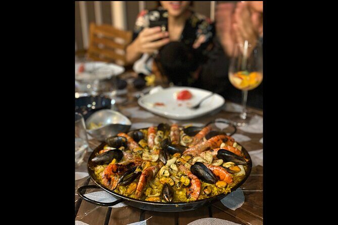 BBQ Paella in a Penthouse Terrace in Barcelona with a Chef - Authenticity and Cultural Touches