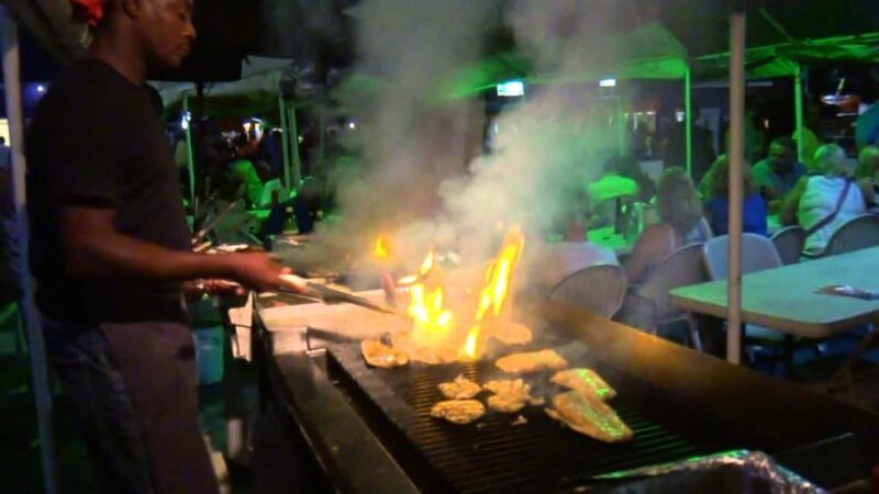 Bridgetown: Oistins reservation with drink & return transfer - Key Points