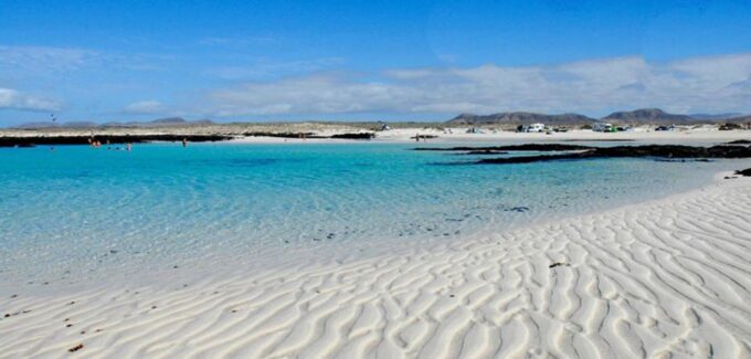 Caleta De Fuste/Corralejo: Guided E-Bike Tour & Crater Hike - Discovering the Charming Town of El Cotillo