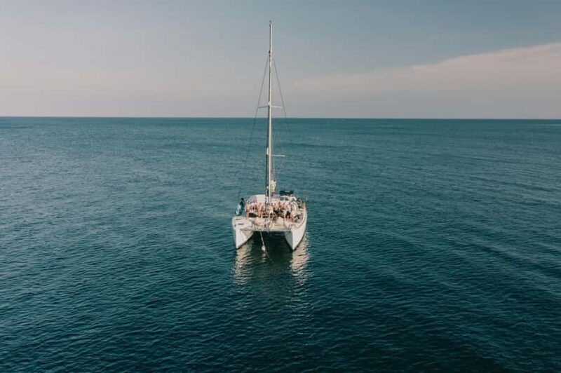 Catamaran Adventure to Isla Mujeres: Snorkeling, Food, and Transportation Included - Key Points