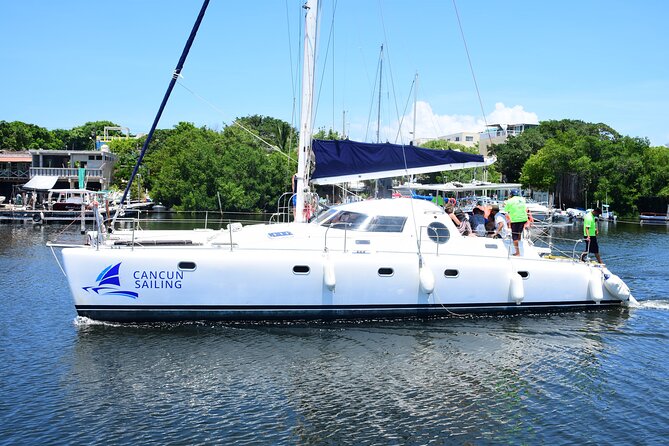 Catamaran Tour to Isla Mujeres, Open Bar, Lunch, Snorkeling, Beach Club Included - Pricing and Capacity
