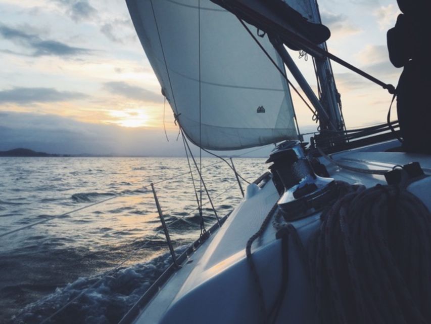 Catania: Sailing Tour to the Cyclops Riviera With Aperitif - Swimming and Snorkeling Opportunities
