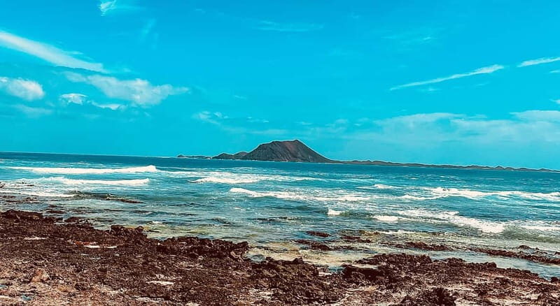 Corralejo: Walking Tour with Rooftop Drink at Sunset - In The Sum Up