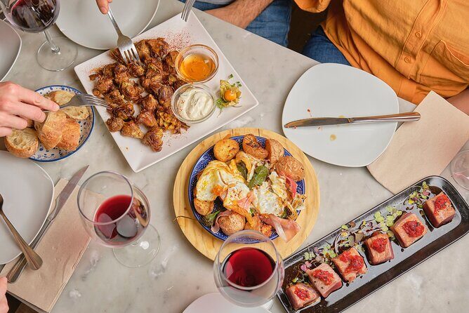 De Tapas in Malasaña: Evening Wine and Tapas Tour - Authentic Flavors and Personal Touches