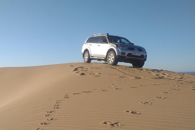 Desert and Wild Beach Day Trip With Meal - Local Culture Experience