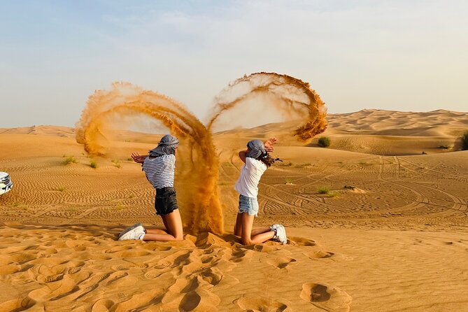 Dubai Desert Safari, Dune Bashing, CamelRide, Sand-boarding - Enjoying Camel Rides
