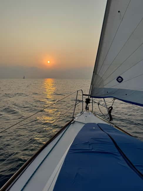 Enjoy the sunrise in Barcelona from a sailboat with drinks & snacks - Key Points