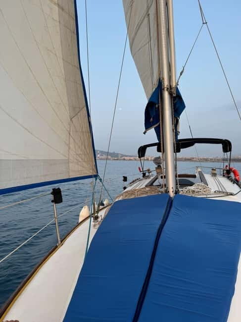 Enjoy the sunrise in Barcelona from a sailboat with drinks & snacks - The Sum Up