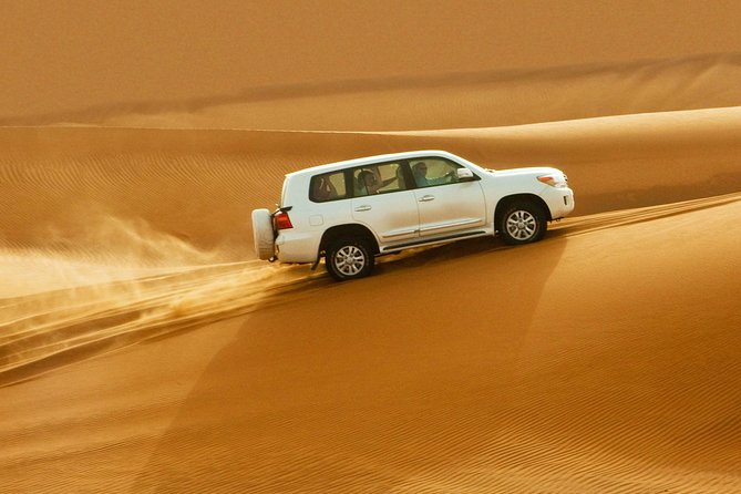 Evening Desert Safari Dubai With Buffet, Dune Bashing, Camel Riding, and Tanura - Dune Bashing Adventures