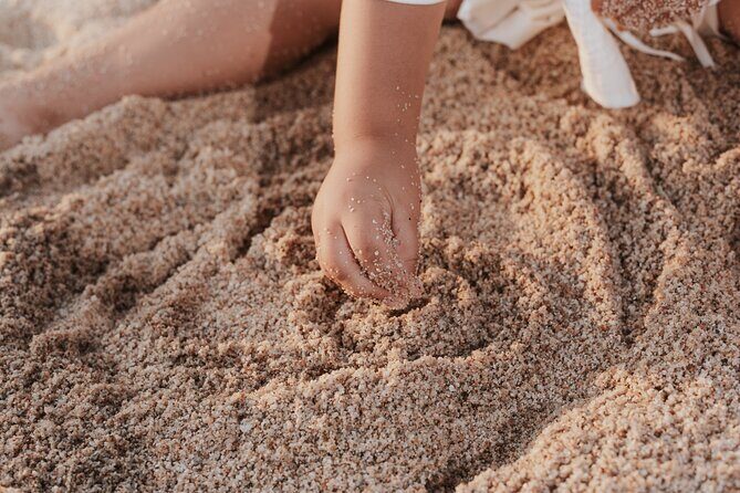 Family photo shoot on beach monuments - The Sum Up