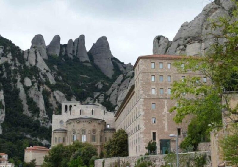 From Barcelona: Train Route and Cable Car to Montserrat - Key Points