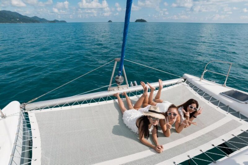From Ornos: Mykonos Delos Catamaran Cruise with Meal & SUP - Key Points