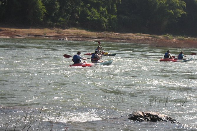 FULL DAY – Kuang Si Waterfall, Kayak on the Nam Ou / Mekong River, Pak Ou Caves - Lao Buffet Lunch
