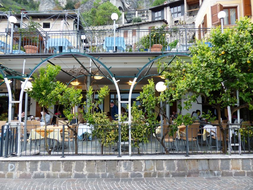 Full-Day Lake Garda Tour: Bus & Public Boat With Guide - Scenic Boat Experience