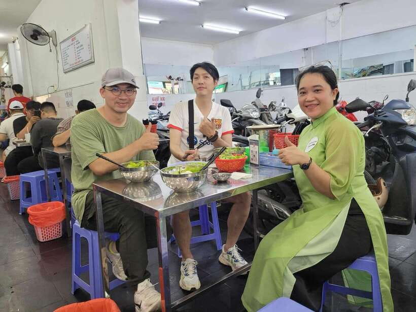 Good Morning Saigon by Motorbike I Option: Female Ao Dai - Experiencing Saigons Vibrant Morning Atmosphere