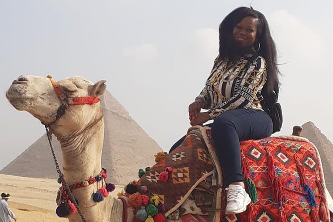 Half-Day Tour of the Giza Pyramids and Solar Boat Museum With Lunch and Camel Ride - Experiencing the Camel Ride