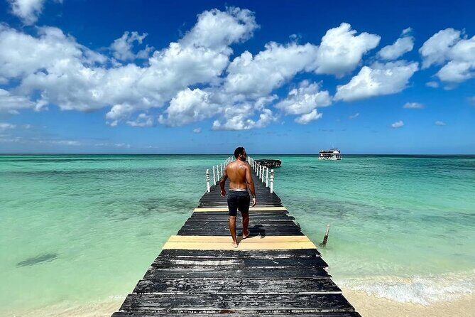 Holbox Island Trip with Boat Ride Biking and Swimming from Cancun - Overview of the Itinerary