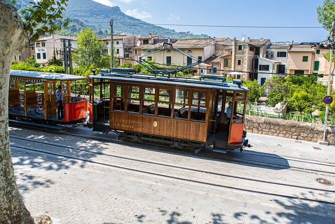Island Tour With Train Tram Boat and Bus From Cala Millor - The Sum Up