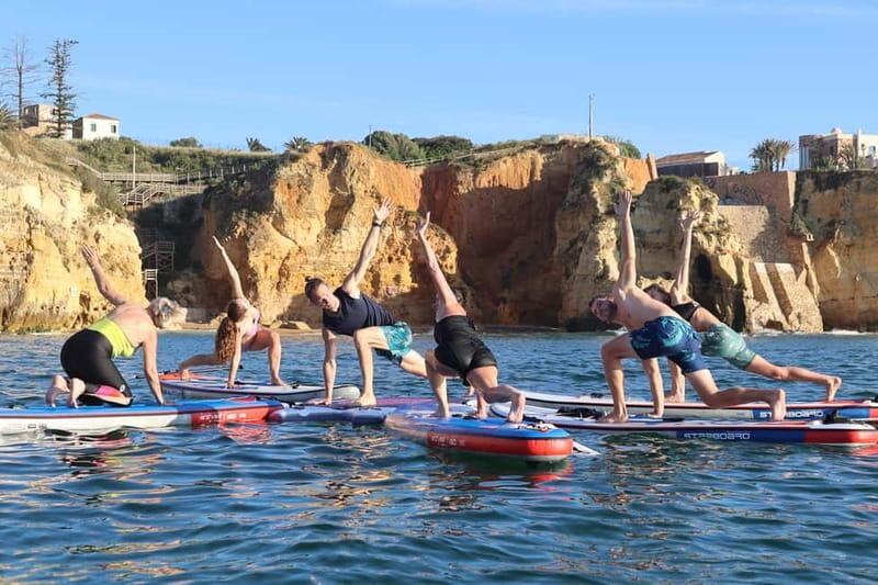 Lagos: Sunrise SUP Yoga Experience at Praia dos Estudantes - An Authentic and Balanced Look at the Sunrise SUP Yoga Experience