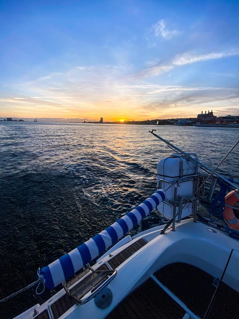 Lisbon: Sunset boat tour with wine - The Sum Up