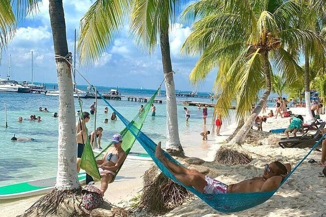 Live this unique experience. Catamaran to Isla Mujeres Tour. Open Bar included. - The Itinerary in Detail