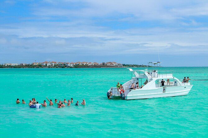 Luxury Catamaran Cruise: Snorkel, Beach Club, Cenote & Open Bar - Relax at Juanillo Beach: The Afternoon Oasis