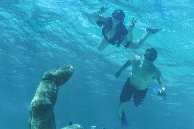 Luxury Sailing Experience to Isla Mujeres with Lunch & Open Bar - Paddleboarding and Water Fun