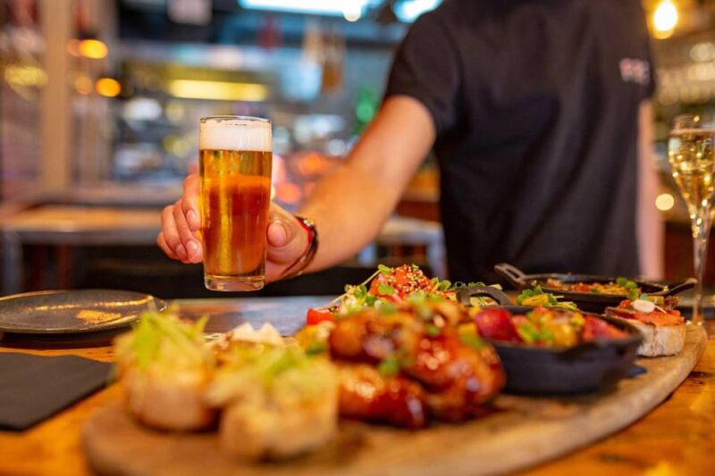 Madrid: Tasty Tapas & Visit to a Terrace With Views - Savoring Tapas and Drinks