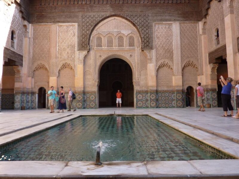 Marrakech: Madrasa Ben Youssef, Secret Garden & Market Tour - Engaging With Local Markets