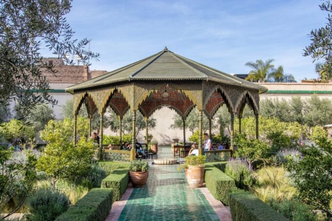 Marrakech: Madrasa Ben Youssef, Secret Garden & Market Tour - Cultural and Historical Insights