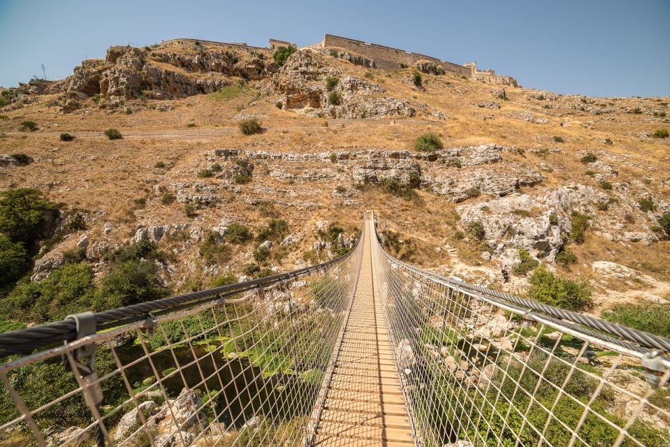 Matera: Sassi, Murgia, and Tibetan Bridge Trip - Visiting the Sassi Caves