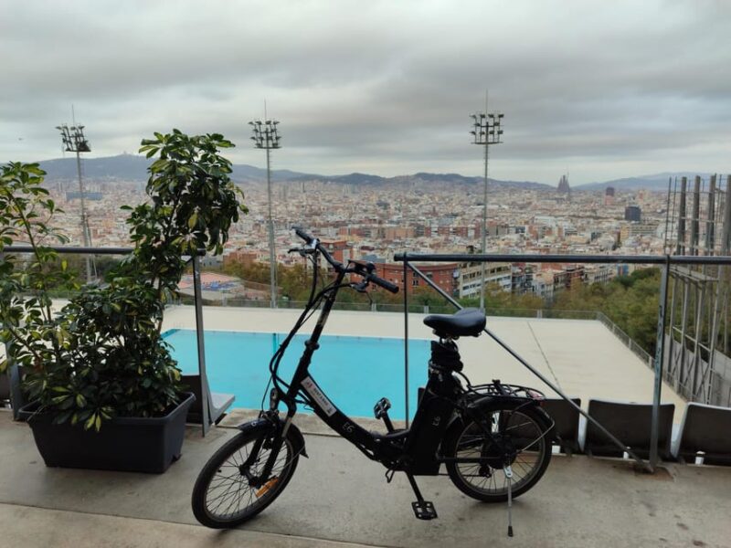 Montjuic Guided E-Bike Tour With Tapas and Panoramic Views - Exploring Palau Nacional