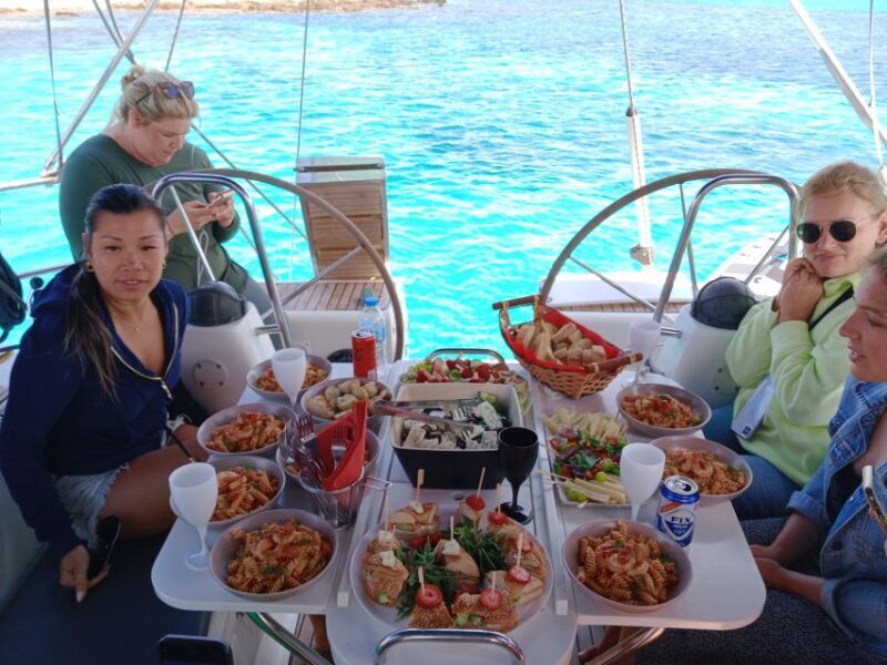Mykonos: Delos and Rhenia Cruise with Swim and Greek Meal - Key Points