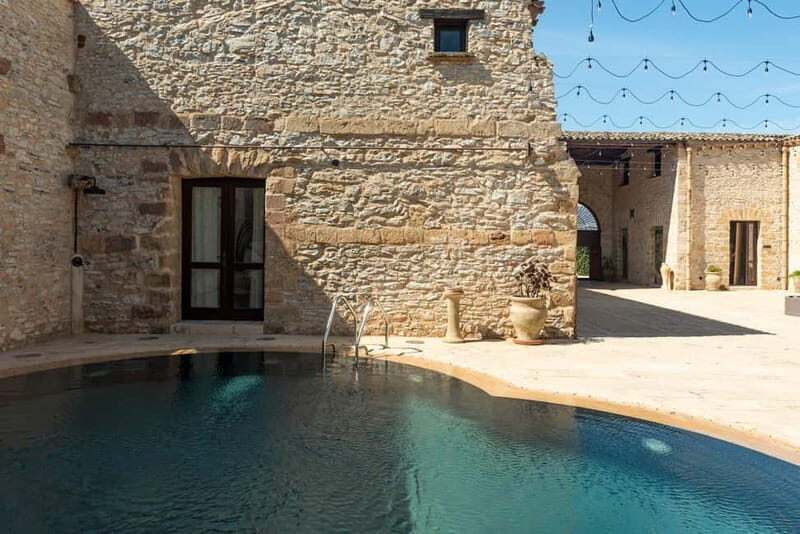 Nature and relaxation by the pool at Baglio Passofondo Estates - Key Points
