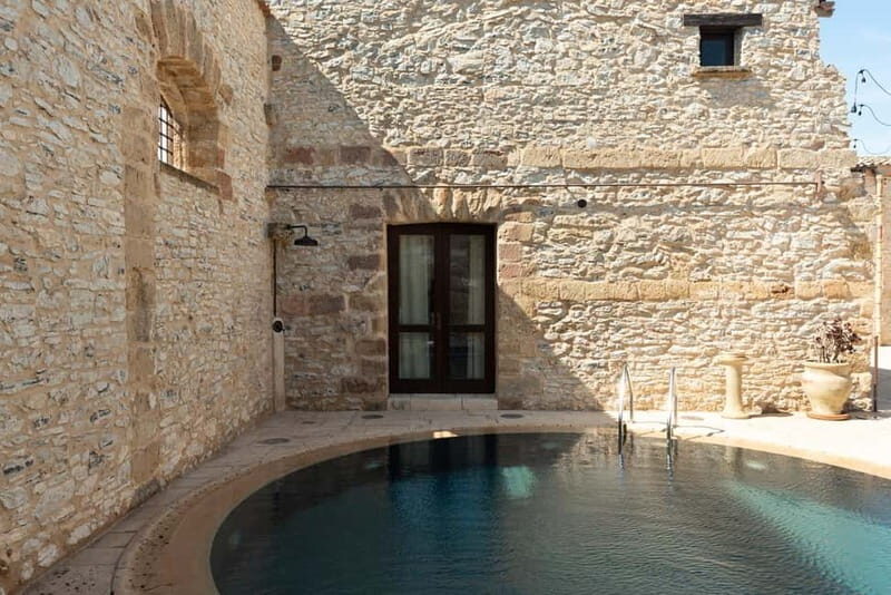 Nature and relaxation by the pool at Baglio Passofondo Estates - The Experience in Detail