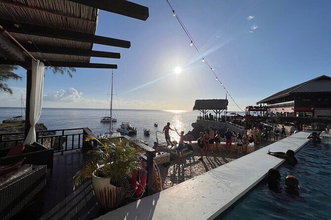 Negril 7 mile Beach, Party Catamaran Cruise and Ricks Cafe Combo - Key Points  