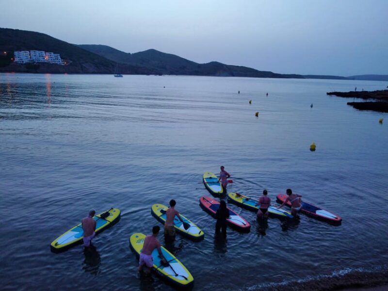 Paddle Surf with Led lights at sunset in Menorca - The Role of the Guide and Group Size